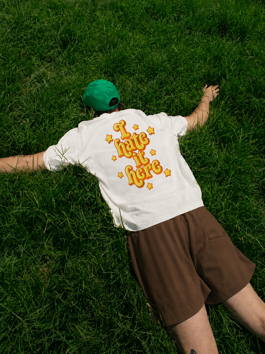 I Hate It Here T-Shirt | Pocket Tee with Retro Yellow Script & Stars